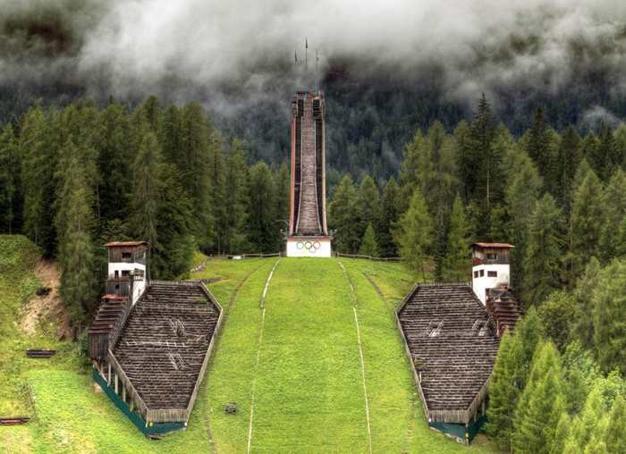 The silent ski jump, Trampolino Olimpico, still carries the Olympic Rings but hasn't carried an event since 1990.