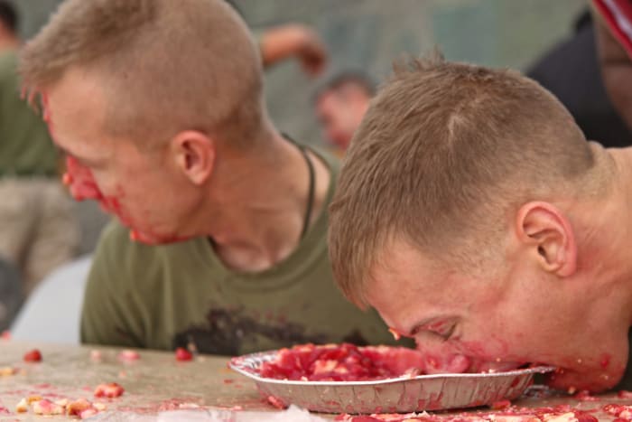 Professional speed eaters can earn thousands of dollars in prizes, but many speed eaters are one-time or occasional participants in local "just for fun" contests, like these Marines.