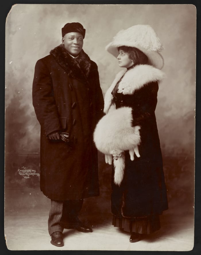 Boxing Champion and his wealthy wife pose for the cameras.