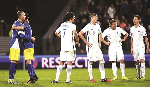 Finland's players (white) stand dejected following the conclusion of its opening 2018 FIFA World Cup qualifier on Sept. 3, 2016. Finland managed a 1-1 draw against Kosovo, who made its World Cup qualifying debut.