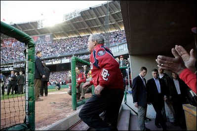 President George W. Bush prepares to throw out the first pitch at the Opening Day game of the Washington Nationals' 2005 inaugural season.