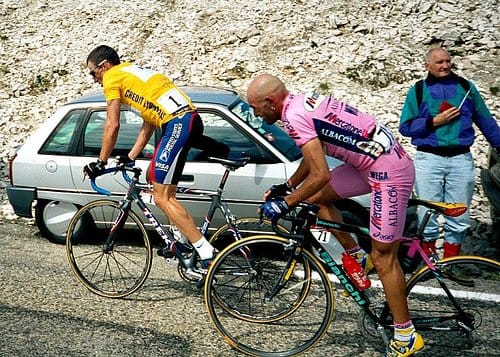 Lance Armstrong climbing ahead of Marco Pantani. Lance Armstrong is on a Trek OCLV Madone with Mavic Ksyrium wheels and Shimano Dura ace components