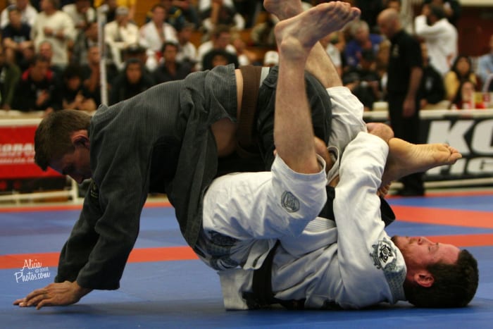 Me using a kneebar from the bottom of half guard in the Pan Ams masters brown belt division in 2008. Photo by Alicia Anthony.