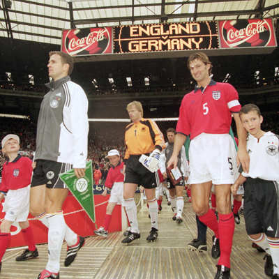 Oliver Bierhoff (gray jacket), Oliver Kahn (1) and Tony Adams (5) walking out onto the field on Oct. 7, 2000 in what was England's final match at the old Wembley Stadium. Germany won 1-0.