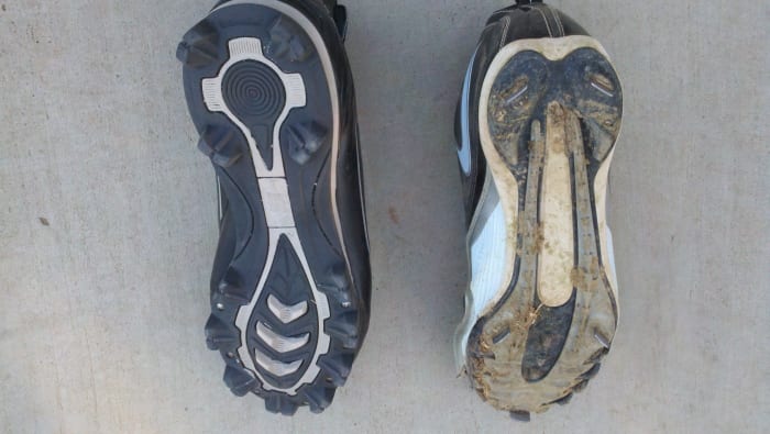 This photo shows the underside of a plastic/rubber cleat on the left and a metal cleat on the right.