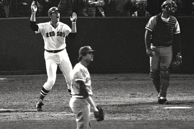 12th Inning, Game 6. Fisk urges his ball to the foul pole. Pitcher Pat Darcy looks on helplessly.