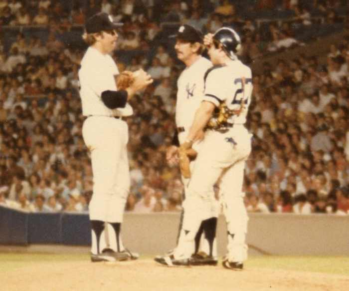 Billy Martin on the mound with Catfish Hunter, probably asking if he can gut it out to finish the game. Hunter had 30 complete games for Martin in 1975.
