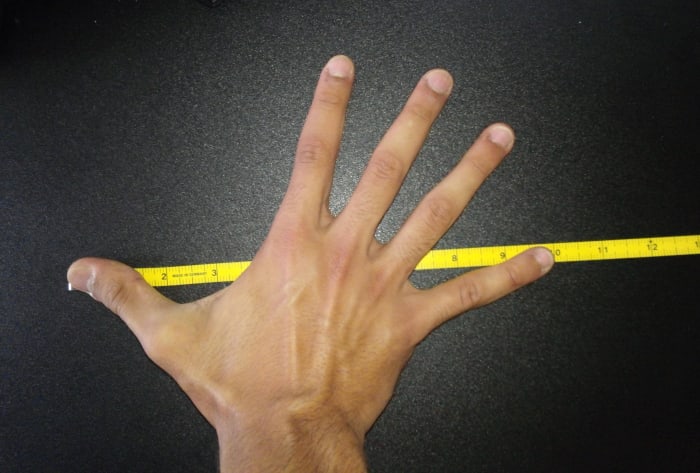 Hand size measurement at the NFL Combine is done by measuring the tip of the thumb to the tip of the pinky finger with the hand outstretched.