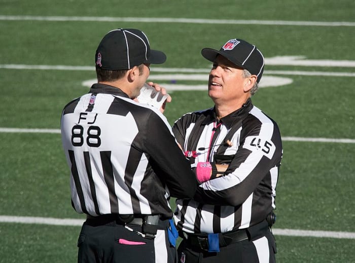 NFL officials communicate when calling penalties, to make sure they get it right.