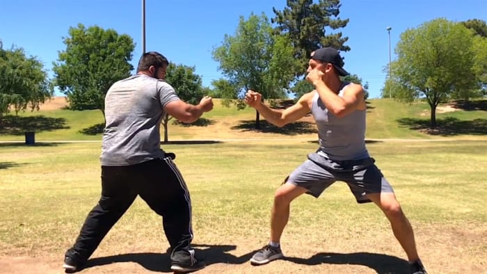 Even street fighting can have positions where to start from. If your opponent assumes your move set, they often mentally prep themselves for that. You can manipulate this by playing outside the box.