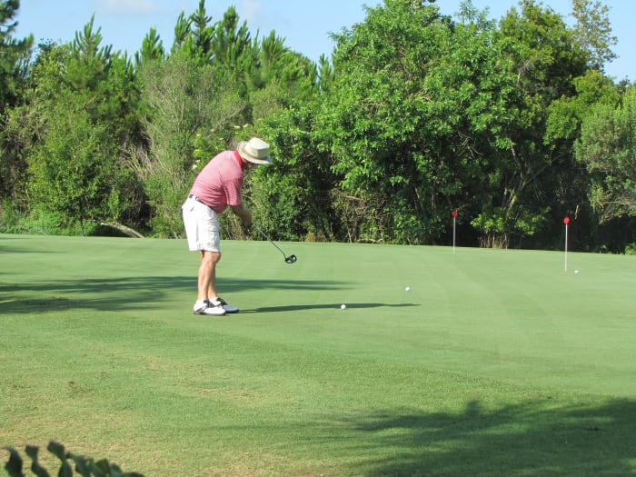 Practice on the putting green before heading out to play. Getting a feel for the greens will help shave off some strokes from your round.
