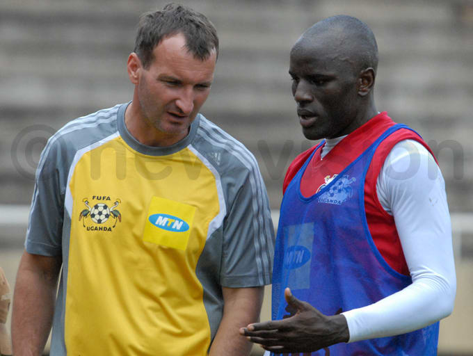 Czaba Laszlo (left) discusses footballing matters with Geoffrey Massa during a training session in 2008. Laszlo was one of three prominent coaches to help Uganda get back on the map.