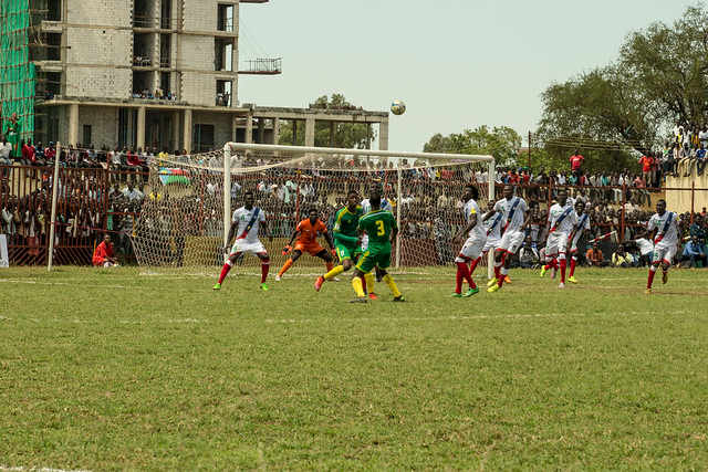 Taghiyoullah Denna (green #17) and Aly Abeid (green #3) are in action for Mauritania during a 2018 FIFA World Cup qualifier in Juba, South Sudan. This qualifier spanned two days during October 2015 due to torrential rain.
