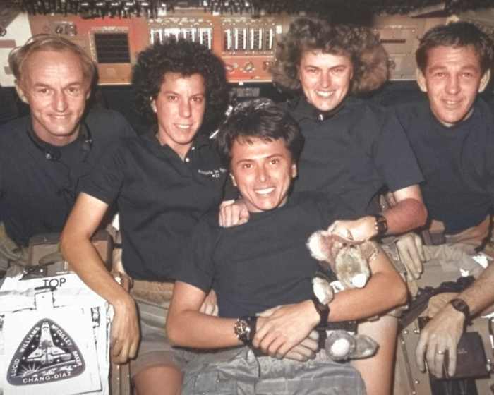 Colorize Photo attempted to color only these astronauts' skin and hair, and it skipped everything else entirely, including one of the subjects' hands.