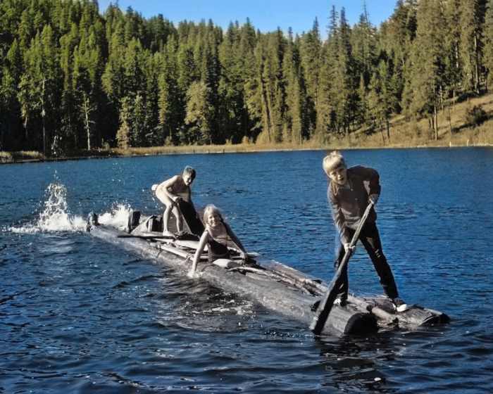 The AI did a good job on the water, the trees and the sky, but it skipped the foreground subjects and their log raft entirely.