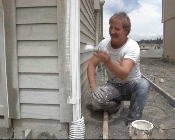 Remember this photo of a painter I showed you earlier? Colorized Photos forgot to color in his hand! Below, I show you how I fix this.