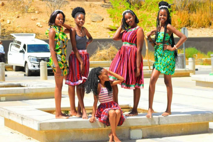 This is a picture that shows women wearing the Owhiwambo traditional attire while some are wearing African attire.