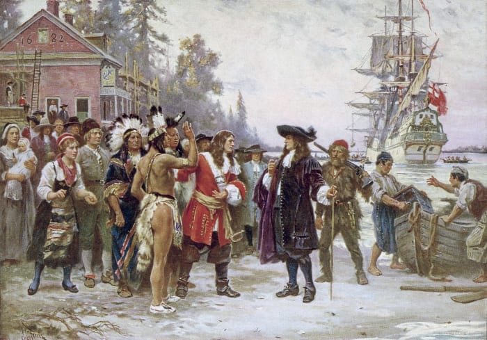 A painting which depicts William Penn, in 1682, standing on shore greeted by a large group of men and women, including Native Americans.
