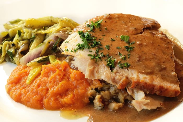 Thanksgiving dinner: roasted American turkey with French bread dressing, bourbon-whipped sweet potatoes, grilled autumn vegetables, and giblet gravy—yum!