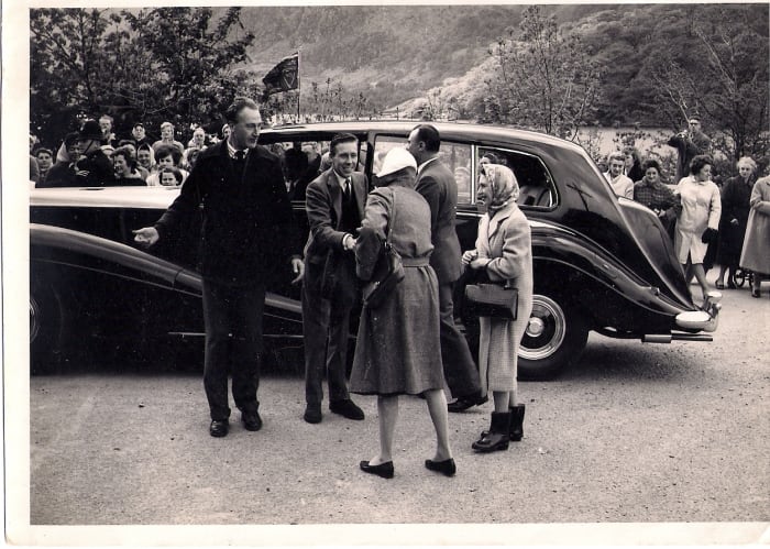 Princess Margaret and Lord Snowdon being welcomed to Llanberis (Ann's head just above the car bonnet, her father standing on the wall, rear right, with camera)