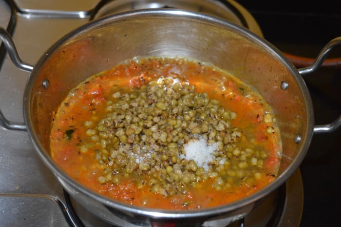 Add sugar and the remaining salt. Continue to cook the mixture. Add 1 cup of water. Cook the mixture for further 2 minutes. Turn off the heat.