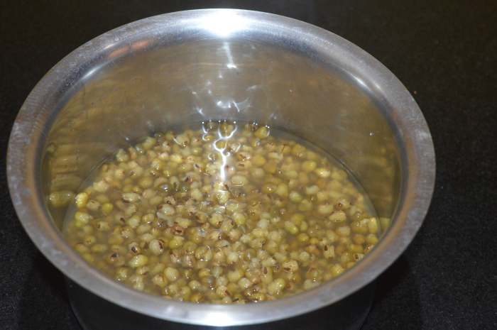 Step two: Cook it in a pressure cooker with some water and salt up to 4 whistles and simmer for 6-8 minutes. when the pressure releases naturally, open the lid and take out the container. Set aside.