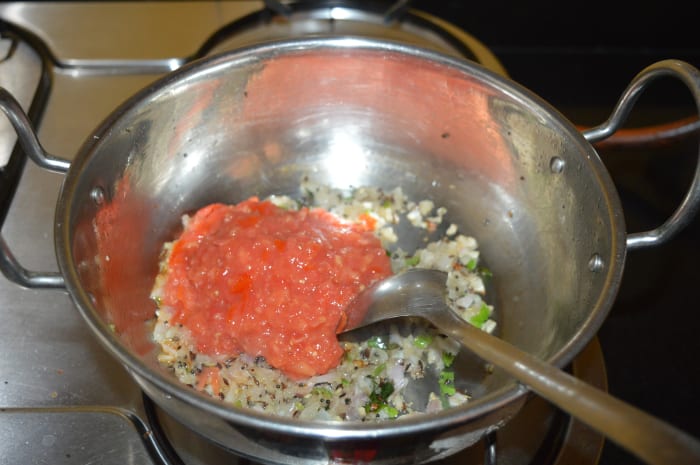 Add chopped tomato and salt. Adding salt helps to cook faster. Increase the heat and continue to saute for 4-5 minutes. Next, reduce heat.