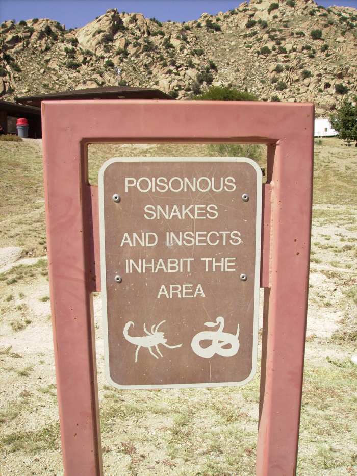 Sign warning about presence of poisonous snakes in the Arizona desert.