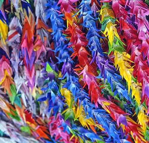 Strings of paper cranes for prayers of peace sent to Peace Memorial Park in Hiroshima. (public domain)