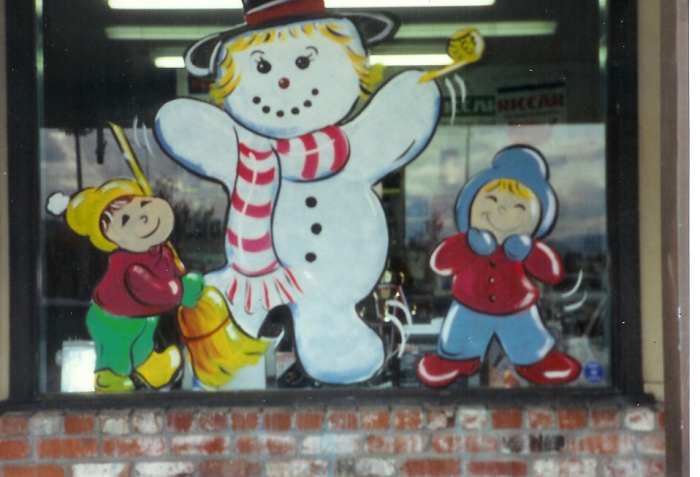 I enjoyed doing happy scenes on the windows. Painting on glass involves using certain types of paint for best results.