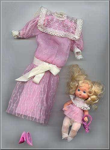 Mr. Heart was so overwhelmed by Barbie's generosity, he gave her his ex-wife's dress that was thrown to the curb with the baby.