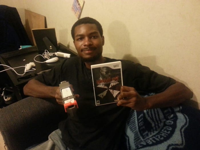 Even though the writer recommends leaving the gun peripheral on the store shelves, he still looks awesome holding it.