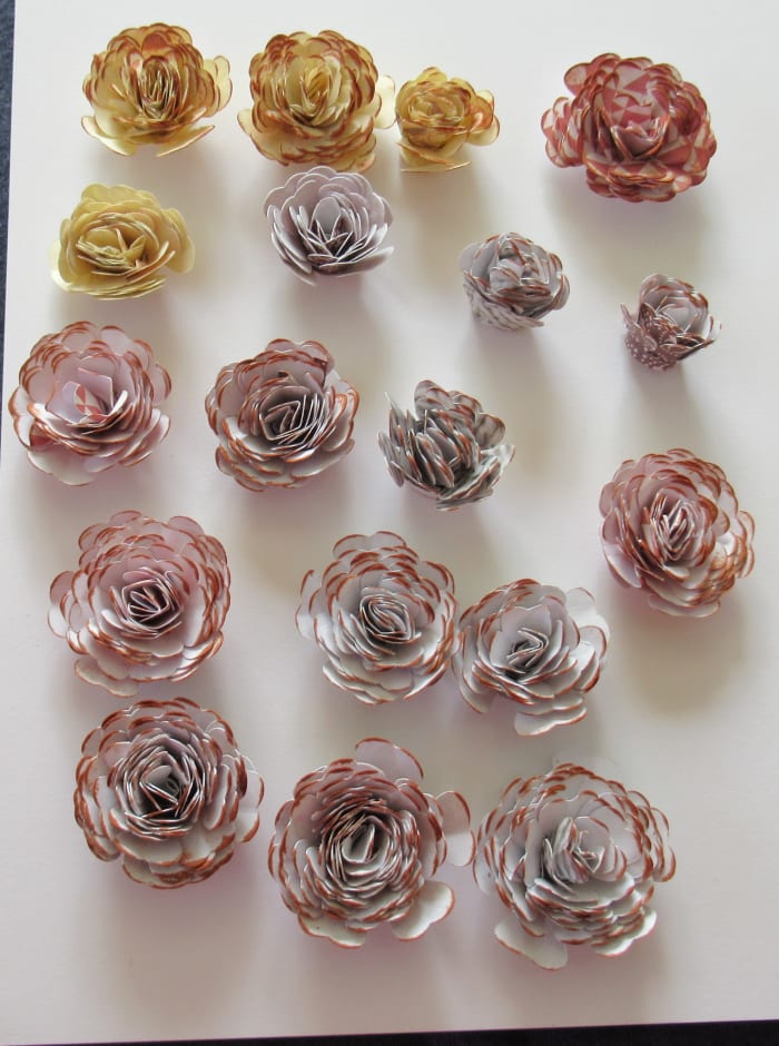 Gently run an ink pad over the top of your rolled flowers to create additional definition. I used a Momento ink called Potters Clay to create the drfinition on these flowers.