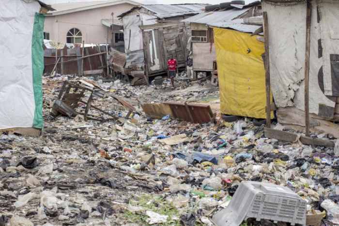 Lagos, Nigeria's Oto-Ilogbo Extension slum. LAGOS, Nigeria -- Along the eastern outskirts of the Lagos mainland neighborhood of Ebute-Metta, an unassuming road hidden between two rows of warehouses winds past dilapidated red-and-yellow buildings dark