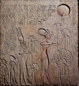 This limestone relief found in the Royal Tomb at Amarna depicts Akhenaton, Nefertiti,and two of their daughters making an offering to the Sun-disk, Aten
