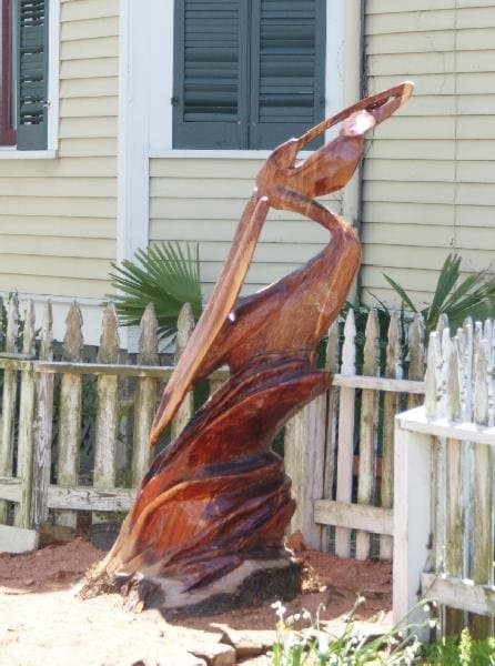 A James Phillips sculpture of a pelican made of cedar is located at 1609 Post Office in Galveston. Image Copyright 2010 Paul Roberts