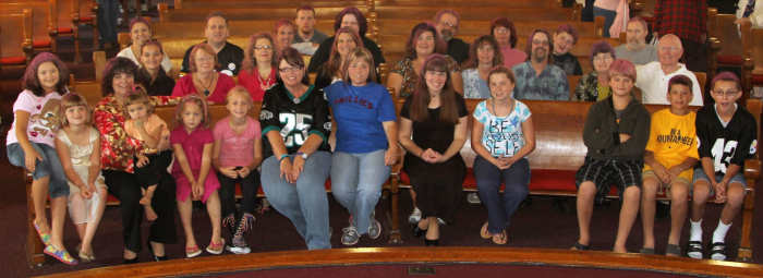 It's our congregation being the body of Christ. We surprised one of our cancer survivors by painting our hair pink for Thyroid Cancer Awareness month. Although you can't see it very well in this photo, every single person here has pink hair.