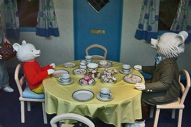 English: Museum of Canterbury with Rupert Bear Museum. The scene in the front window of the museum shows Rupert and his father having tea
