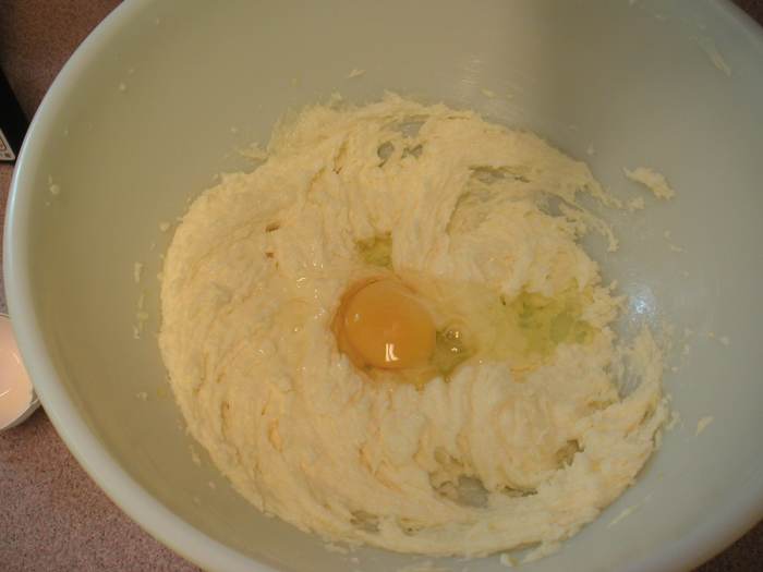 Cream the butter, add the sugar and mix until smooth. Add the eggs one at a time beating after each egg.