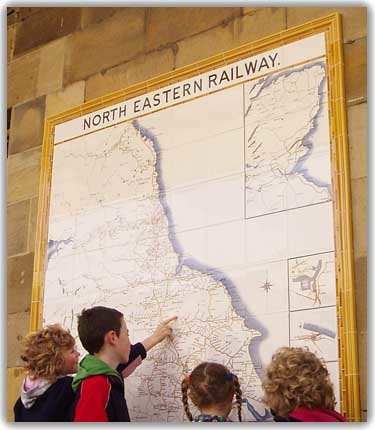In 2009 a new tile map was added to the station wall at Pickering in the style of tile map found across the NER system at larger stations. One of a group of children points to her own local station on the western edge of the North Yorkshire Moors