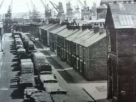 The view in the 1950s along Lower East Street, Middlesbrough towards the docks on the Tees. Within decades the docks were cleared and re-located near Teesmouth. Most dockyard workers' jobs disappeared through mechanisation