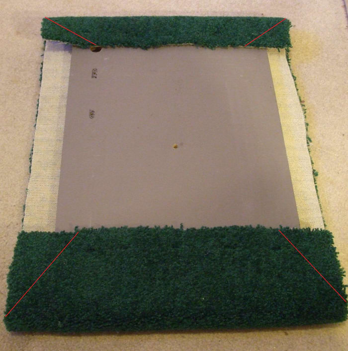 In this photo, the side carpet is much too narrow. It was hard to fold it up and over the board and have enough to staple into the board.