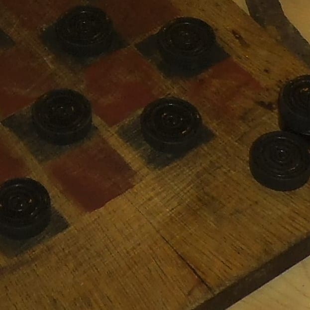 These were simple to make with a square board and some red and black paint. Cut slices from a slender tree branch to make the checker pieces.