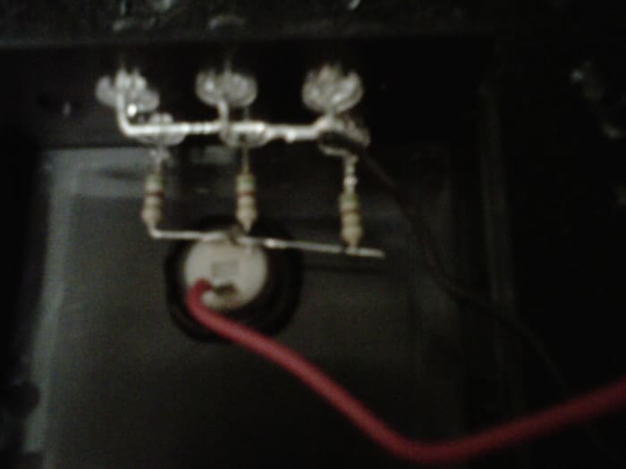 Everything installed. See how I've put the button right up against the + side so I could solder it directly. The negative side is connected by the black wire from the battery connector. The + side from the connector goes to the other lead on the b