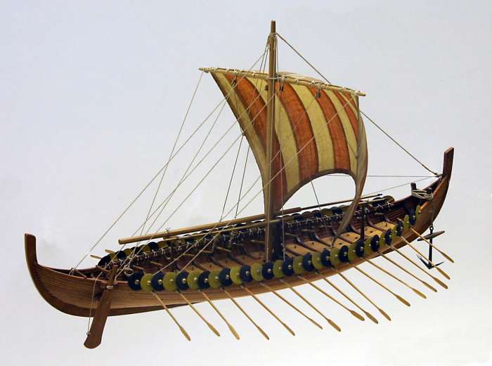 A model of the Gokstad ship. The shields would have been taken in before the oars were run out for rowing. Also, if the sail was up and full with the wind there would be no need for the oars to be in their holes. Modeller's license.