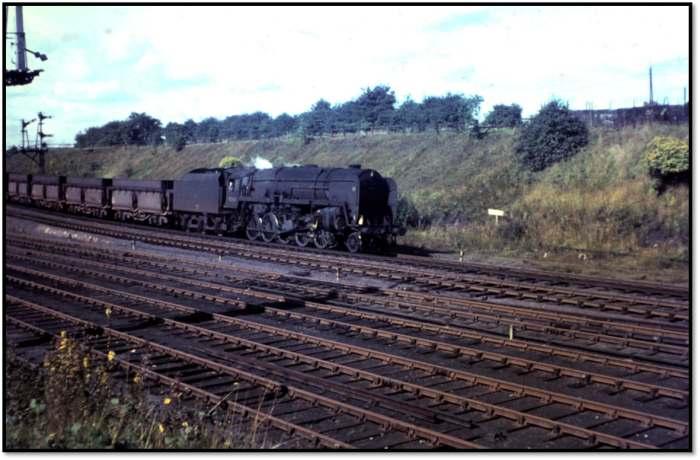 Just to show what a 9F 2-10-0 was used for - an unidentified member of the class drifts downhill through South Pelaw Jct with a train of empty 56 ton iron ore hoppers on her way back to Tyne Dock to be reloaded