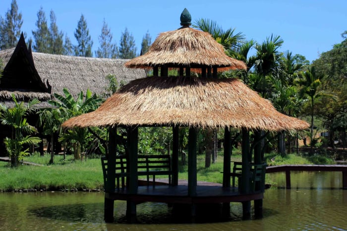 The exhibits of Muang Boran from the most extravagant to the simplest such as this shaded platform on the water, are all attractively designed and arranged in natural settings