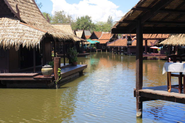 The riverside restaurants offer an attractive setting for lunch. One of the restaurant tables is just visible on the right of the picture