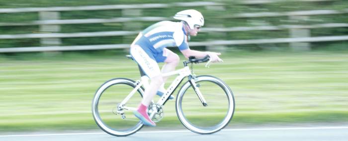 A cycling Panning Photo- following the cyclist in focus through the shutter trigger and release mechanism 1/60th sec, F4.0 ISO 400.