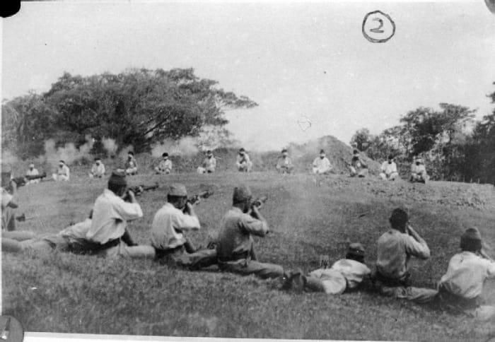Japanese soldiers shooting dead a number of Sikh prisoners that had served with the British.